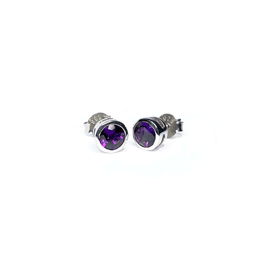 Front view of Amethyst Tube Set Stud earrings displaying a 5mm round Amethyst gemstone set in a Sterling Silver tube setting.