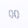 Blue Topaz Huggies
