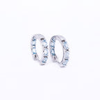Blue Topaz Huggies