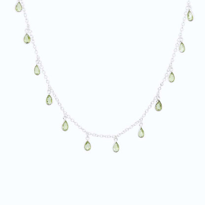 Front view of Sterling Silver necklace with eighteen 5 x 3mm pear-shaped Peridot gemstones on 42cm chain, 5cm extension.