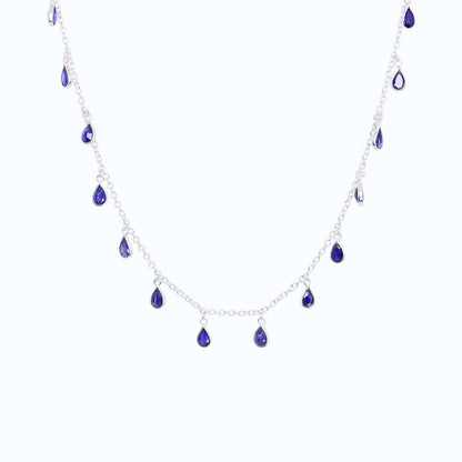 Front view of Sterling Silver necklace with eighteen 5 x 3mm pear-shaped Sapphire gemstones on 42cm chain, 5cm extension.