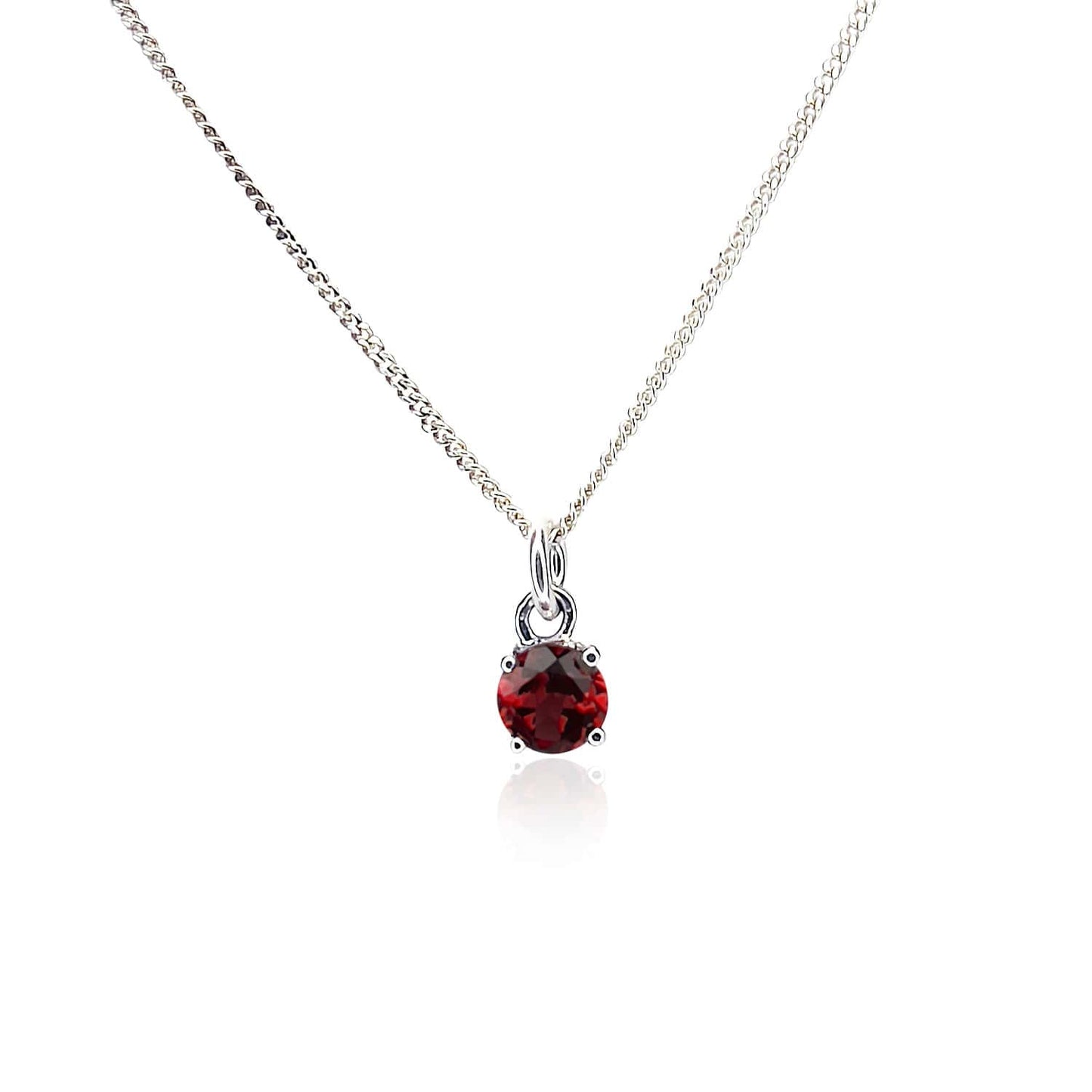 Front view of the Garnet Pendant Sterling Silver necklace on a white background. The necklace features a 5mm round Garnet gemstone set in four claws on a 45cm curb chain.