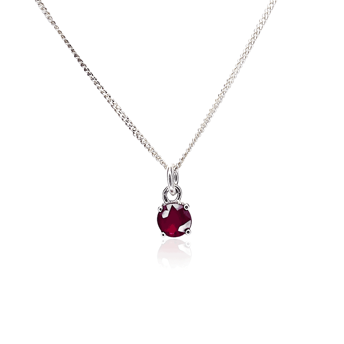 Image displaying Sterling Silver Ruby Pendant necklace with a 5mm round Ruby gemstone set in four claws on a 45cm curb chain.