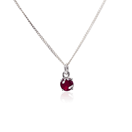 Image displaying Sterling Silver Ruby Pendant necklace with a 5mm round Ruby gemstone set in four claws on a 45cm curb chain.