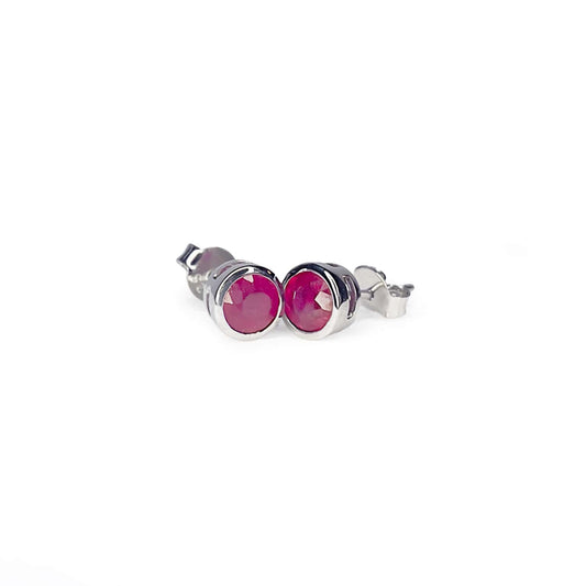 Front view of Ruby Tube Set Stud earrings displaying a 5mm round Ruby gemstone set in a Sterling Silver tube setting.