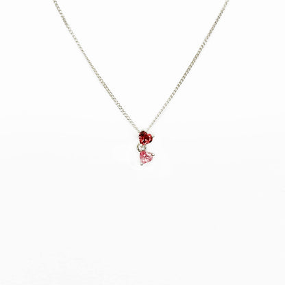 Enhance your style with our Double Heart necklace featuring two interlinked heart-shaped pink gemstones. Crafted with love and passion, this Sterling Silver slider pendant symbolizes unbreakable bonds and adds a touch of elegance to any outfit. Perfect for expressing self-love or sharing with a loved one. Get yours today and add a mermazing touch to your everyday look!