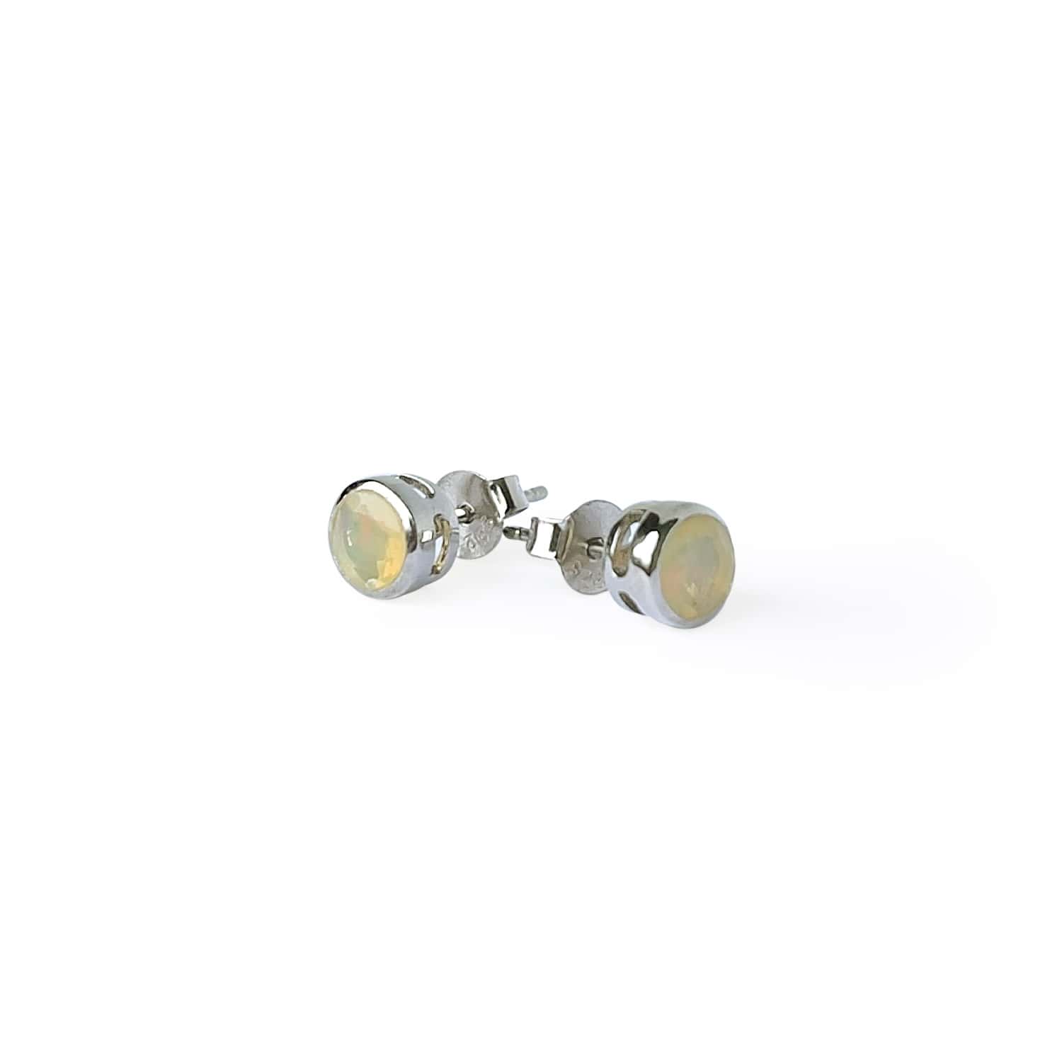 Front and side views of Ethiopian Opal Tube Set Stud earrings showcasing a 5mm round Ethiopian Opal gemstone set in a Sterling Silver tube setting.