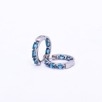 London Blue Topaz Huggies