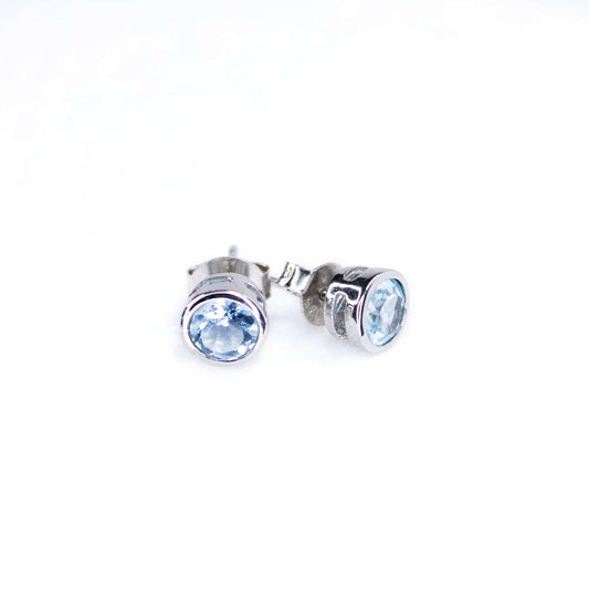 Front view of Topaz Tube Set Stud earrings displaying a 5mm round Topaz gemstone set in a Sterling Silver tube setting.