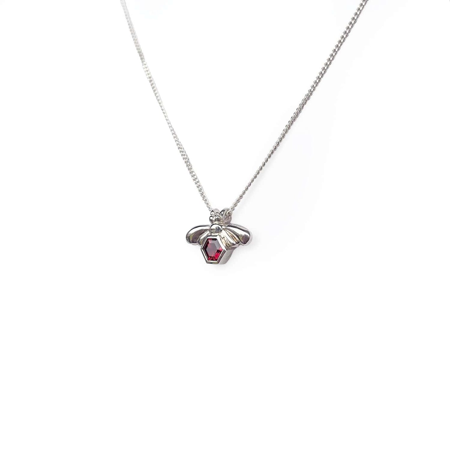 Close-up side view of the Bee-YOU-tiful Bee Garnet Bling, featuring a 45cm curb chain and a Sterling Silver pendant with a bee and a 4mm hexagonal Garnet set in its belly.