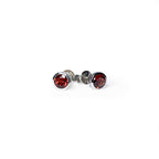 Front and side view of Garnet Tube Set Stud earrings on a white background. The earrings feature a 5mm round Garnet gemstone set in a Sterling Silver tube setting.