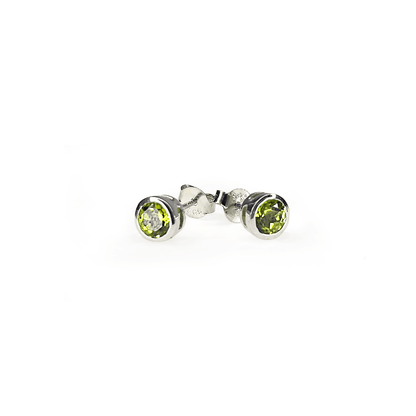 Slight side view of Peridot Tube Set Stud earrings showcasing a 5mm round Peridot gemstone set in a Sterling Silver tube setting.