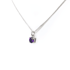 Close-up view of the Amethyst Pendant necklace, showcasing a 5mm round Amethyst gemstone set in four sterling silver claws on a 45cm curb chain.