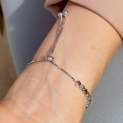 Sterling Silver Tennis Bracelet showcasing 30 Round Brilliant Cut Multicoloured Tourmaline gemstones, viewed from the top with visible clasp.