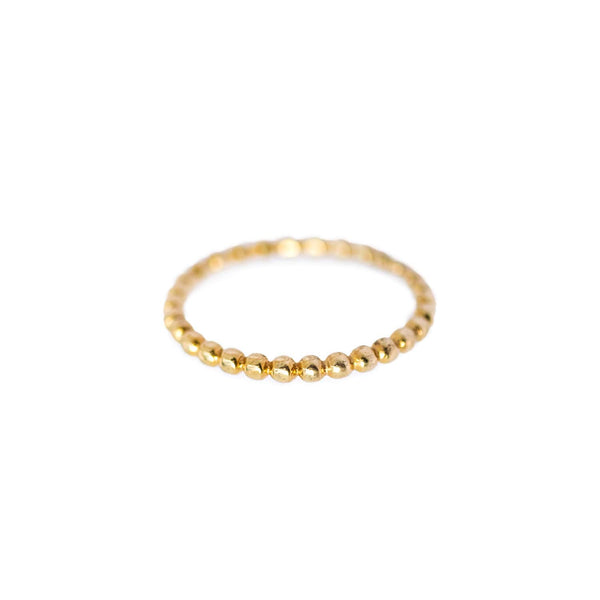 Flat lay of the Ball ring on a white background with a slight top view. Versatile sterling silver yellow gold plated design for any occasion.