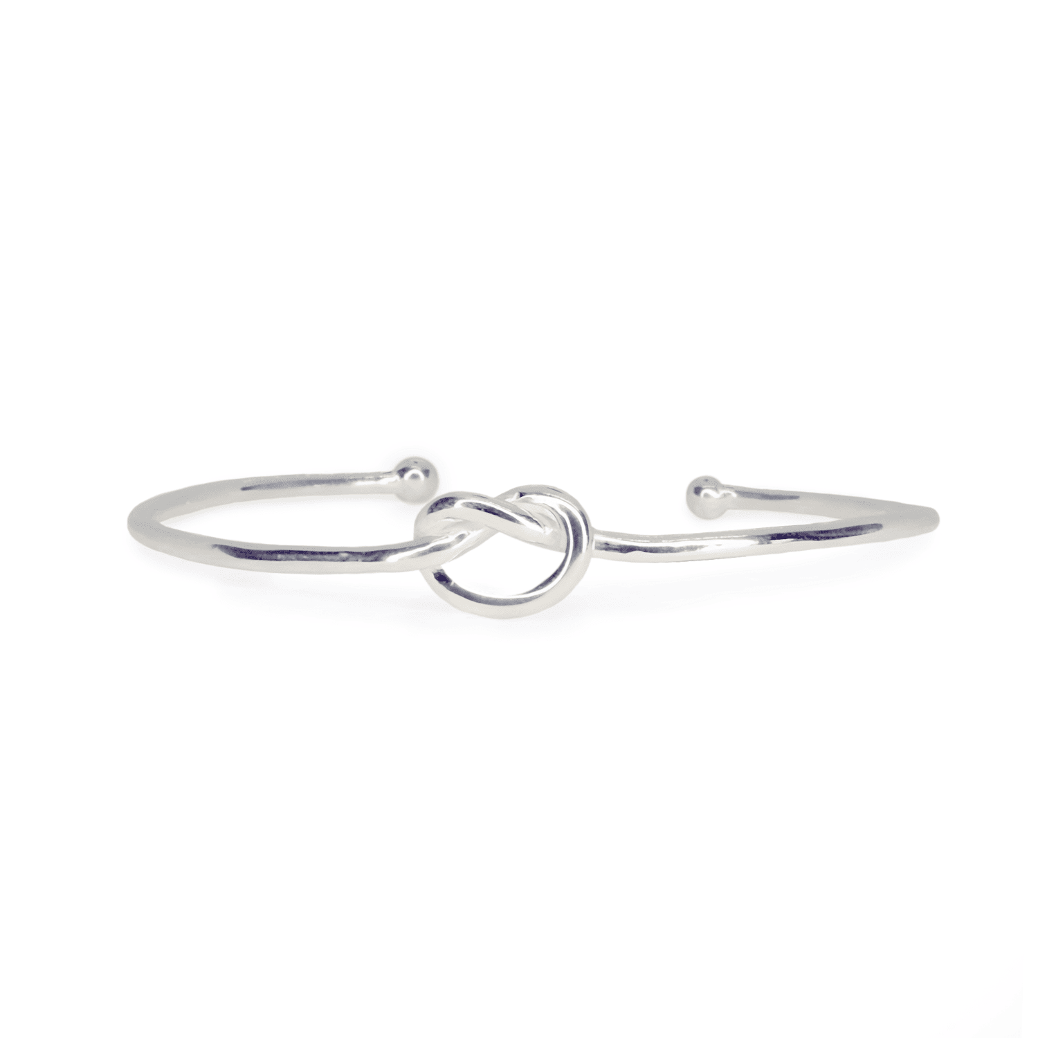 Front view of Love Knot Bangle ring on white background. Sterling Silver wire cuff with centre knot, approximately 2.4mm thick.