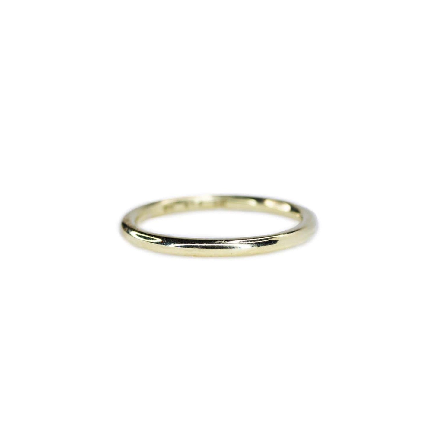 Sterling Silver Yellow Gold plated ring on white background. Approximately 2mm wide band with sleek, sophisticated design and polished surface.