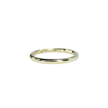 Sterling Silver Yellow Gold plated ring on white background. Approximately 2mm wide band with sleek, sophisticated design and polished surface.