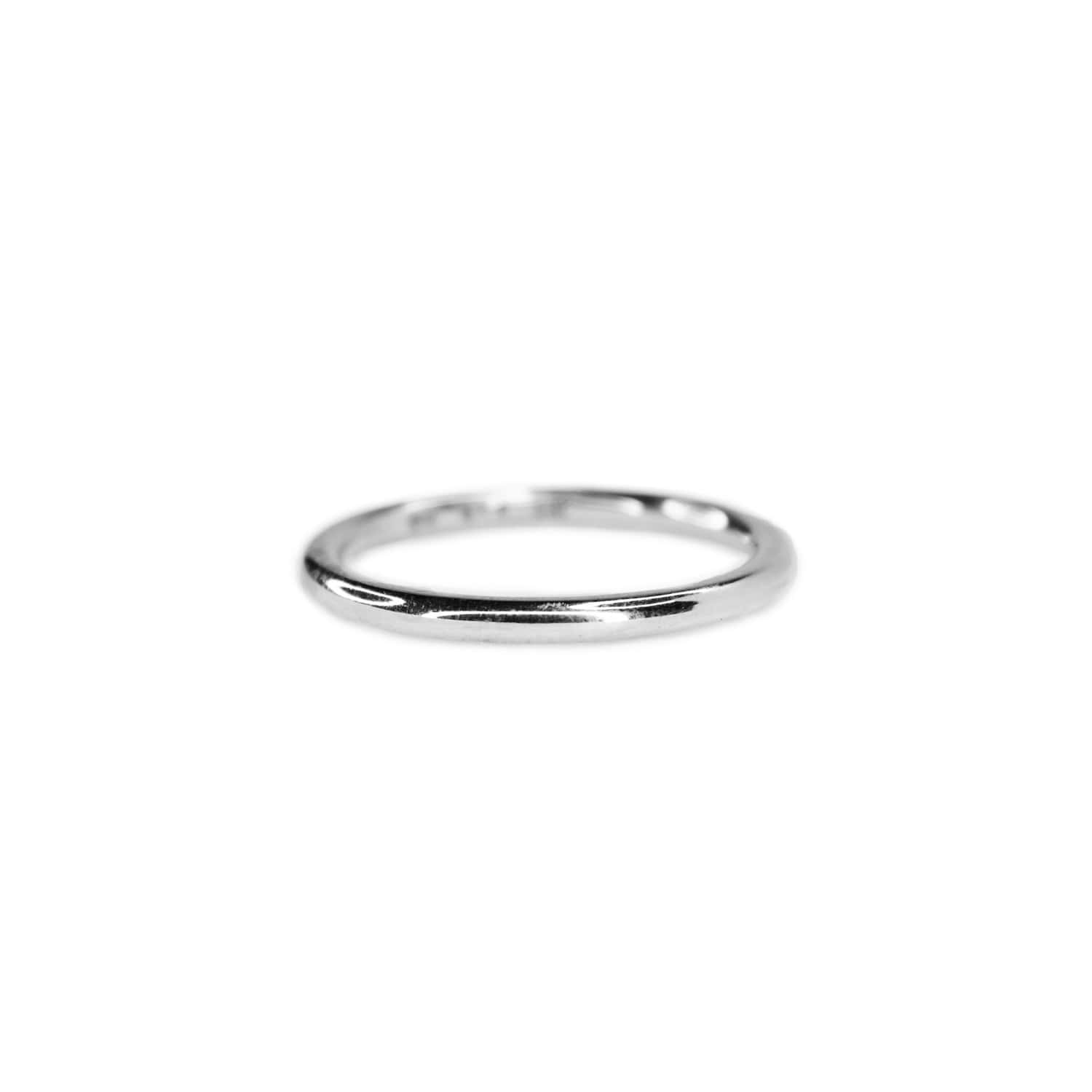 Sterling Silver ring on white background. Approximately 2mm wide band with sleek, sophisticated design and polished surface.